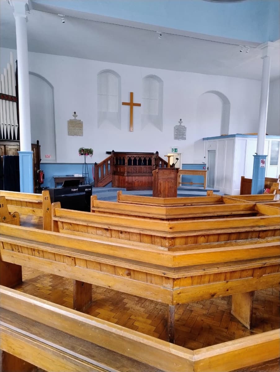 The interior of Ottery St Mary URC Church, pews and chancel