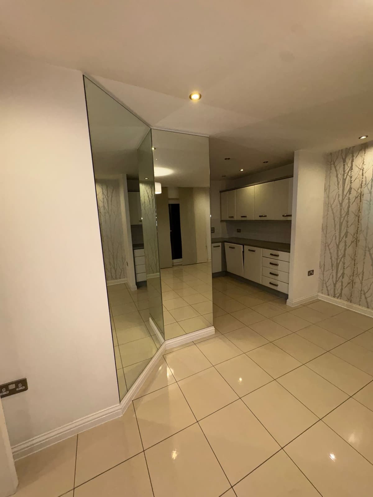 A cleaned hallway and kitchen with polished tiled floor