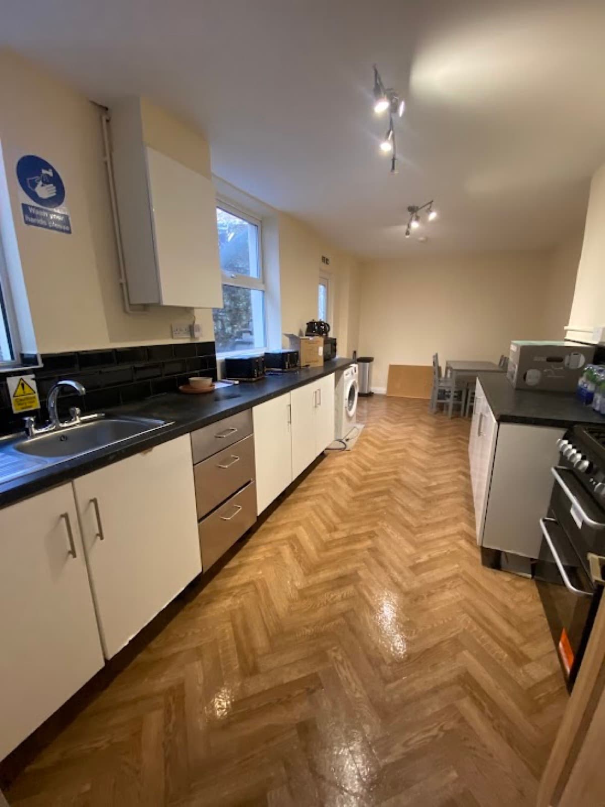 A finished kitchen after a builders' clean, floor washed and units cleared