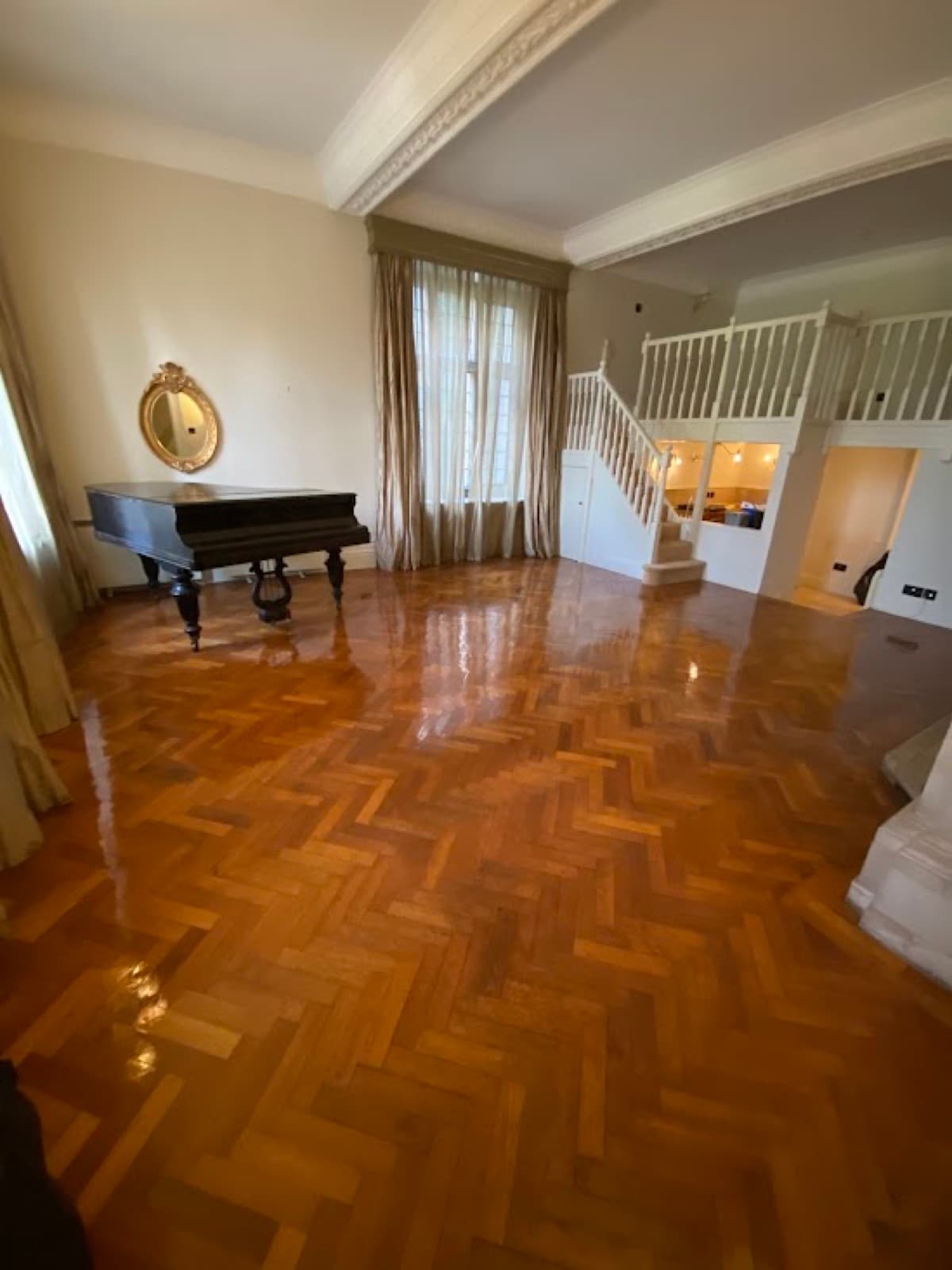 A cleaned parquet floor in a large reception room